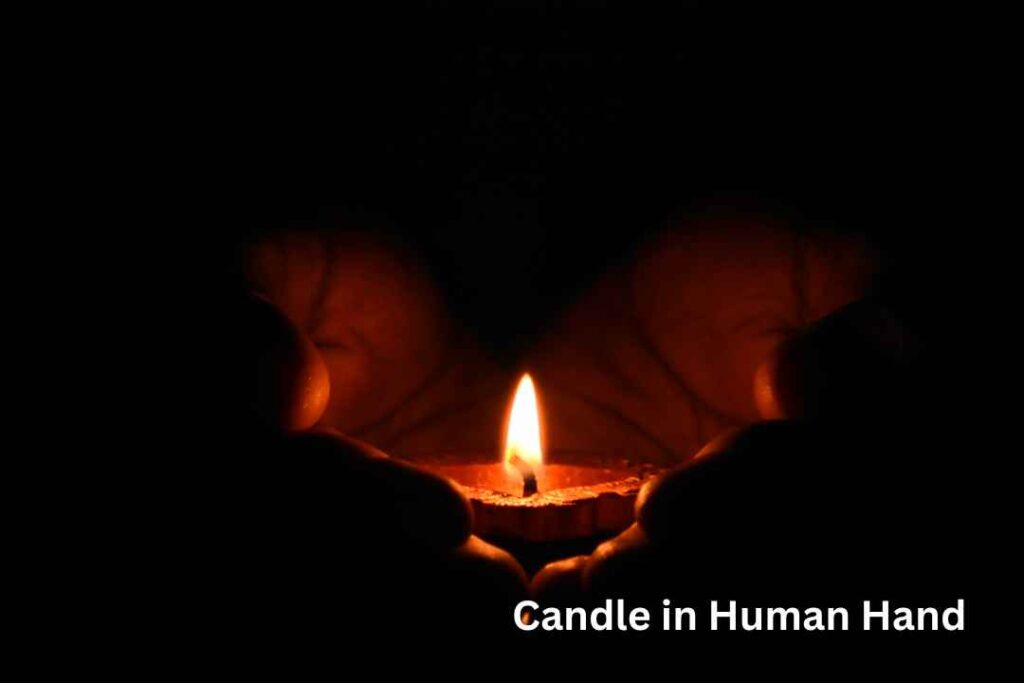 Candle in Human Hand